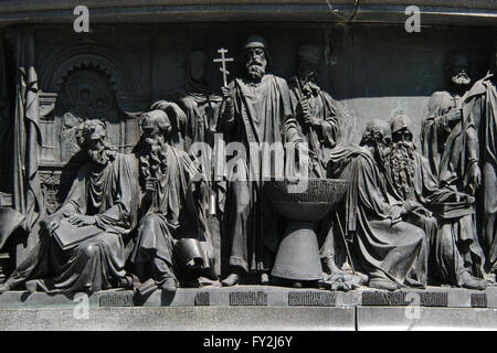 Russian Saints and spiritual leaders depicted in the bas relief dedicated to Russian men of enlightenment by Russian sculptor Matvey Chizhov. Detail of the Monument to the Millennium of Russia (1862) designed by Mikhail Mikeshin in Veliky Novgorod, Russia. Persons from left to right: Saints Cyril and Methodius (sitting), Saint Olga of Kiev, Saint Vladimir the Great, Saint Abraham of Rostov, Saints Anthony and Theodosius of Kiev (sitting), the founders of the Kiev Pechersk Lavra, and Saint Kuksha of the Kiev Caves. Stock Photo
