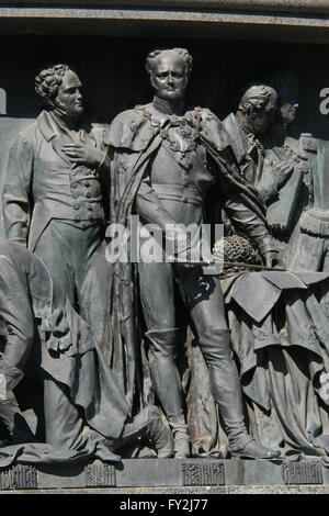 Emperor Alexander I of Russia depicted in the bas relief dedicated to Russian statesmen by Russian sculptor Nikolai Laveretsky. Detail of the Monument to the Millennium of Russia (1862) designed by Mikhail Mikeshin in Veliky Novgorod, Russia. Russian statesman and diplomat Viktor Kochubey is depicted in the left. Russian reformist Mikhail Speransky (L) and Russian military leader Mikhail Vorontsov (R) are depicted in the right. Stock Photo