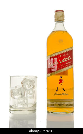 Winneconne, WI - 10 March 2016: A bottle of Johnnie Walker Red whisky with a empty glass of ice. Stock Photo