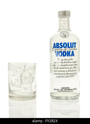 Winneconne, WI - 15 March 2016:  A bottle of Absolut vodka with a glass of ice Stock Photo