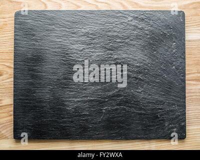 Graphite plank on the wooden table. Stock Photo