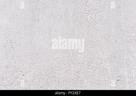 Crackles of paint on the old gray wall. Stock Photo