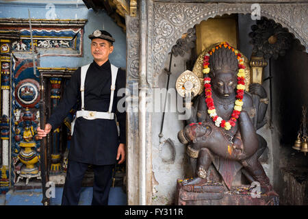 Solider and God - Kathmandu Durbar Square Palace, Nepal. Stock Photo