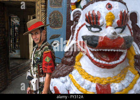 Soldier and stone lion ridden by shiva right side of entrance to Hunuman Dhoka, former Royal Palace, Durbar square Kathmandu Nep Stock Photo