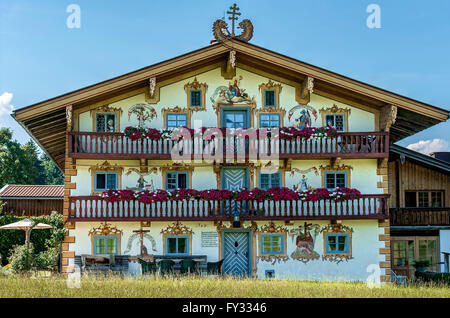 Wiedenhof farmhouse, painted with Bavarian Lüftlmalerei with red geraniums on balconies, Fischbachau, Upper Bavaria, Bavaria Stock Photo