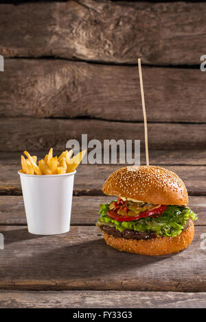 Fries and burger on stick. Stock Photo