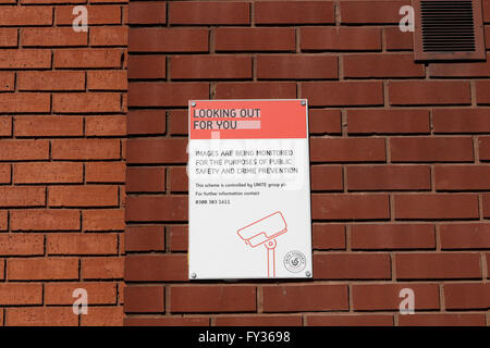 CCTV warning sign on wall of residential block Stock Photo