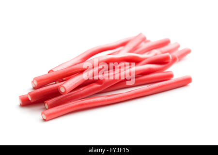 Sweet gummy sticks with strawberry and raspberry flavor. Tasty candies isolated on white background. Stock Photo