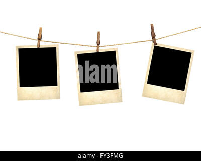 Old style photographs  hanging on a clothesline isolated on white background Stock Photo