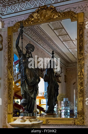 A statue in front of a mirror in Keighley cliffe castle museum, West Yorkshire, England. Stock Photo
