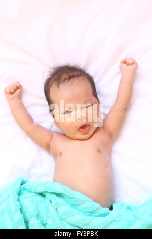 Newborn baby of asia relax in a good mood on white bed and looked happy,good health. Stock Photo