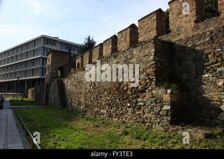 Remains of the western castle wall crenelations, part of the octagonal tower construction following along the seafront of city. Stock Photo