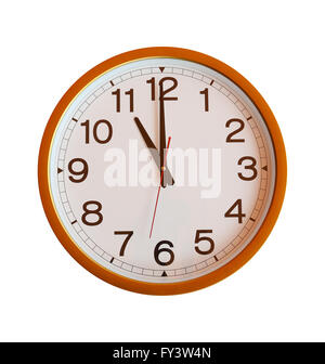 orange wall clock isolated in eleven o'clock on white background. Stock Photo