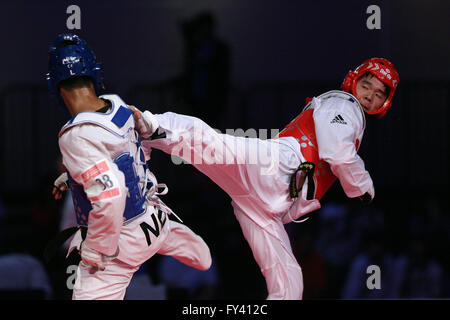 Pasay City, Philippines. 20th Apr, 2016. Kim Hun of South Korea (R) competes against Shaksham Karki of Nepal during the quarterfinal match in men's -74kg category in the 22nd Asian Taekwondo Championships in Pasay City, the Philippines, April 20, 2016. Kim won 6-2. © Rouelle Umali/Xinhua/Alamy Live News Stock Photo