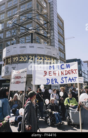 Berlin, Berlin, Germany. 21st Apr, 2016. Protesters during the protest of disability rights activists in front of the world clock on Alexanderplatz in Berlin. The protesters ask for a full implementation of the Disability Rights Convention of the United Nations as part of the promised federal participation law and support for assistance and domestic care regardless of income. Credit:  Jan Scheunert/ZUMA Wire/Alamy Live News Stock Photo