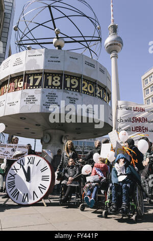Berlin, Berlin, Germany. 21st Apr, 2016. Demonstrators during the protest of disability rights activists in front of the world clock on Alexanderplatz in Berlin. The protesters ask for a full implementation of the Disability Rights Convention of the United Nations as part of the promised federal participation law and support for assistance and domestic care regardless of income. Credit:  Jan Scheunert/ZUMA Wire/Alamy Live News Stock Photo