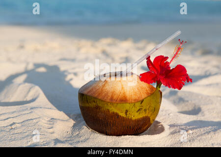 coconut drink on exotic tropical maldives beach Stock Photo