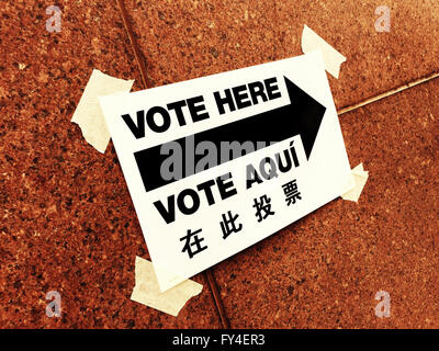 Vote Here Directional Sign in English, Spanish and Chinese, NYC Polling Location, USA Stock Photo