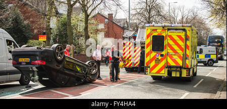 Black Audi car upside down, white transit, labour party banner, ambulance, policeman, firemen, fire engine, police van, bus Stock Photo