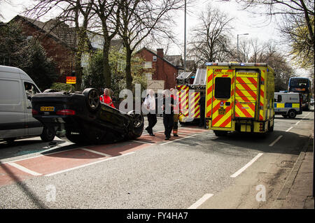 Black Audi car upside down, white transit, labour party banner, ambulance, policeman, firemen, fire engine, police van, bus Stock Photo