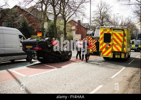 Black Audi car upside down, white transit, labour party banner, ambulance, policeman, firemen, fire engine, police van, bus Stock Photo