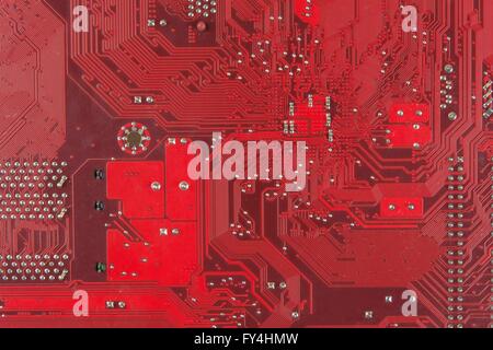Closeup electronic circuit board dirty. Computer board with chips and components. Computer red Motherboard Close Up Stock Photo