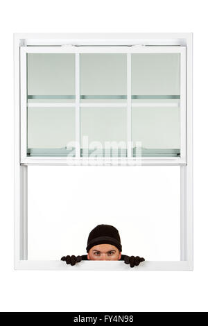 Series with Caucasian male as a burglar or thief, sneaking in a window, carrying stolen goods, etc.  Isolated on white backgroun Stock Photo