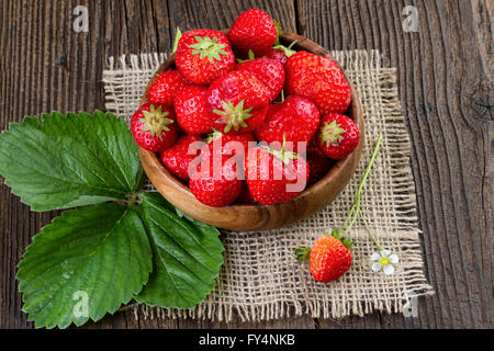 Strawberry wooden bowl, retro styled. Stock Photo