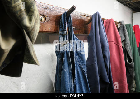 Work Clothes Hanging on Pegs, USA Stock Photo