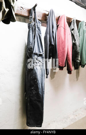 Work Clothes Hanging on Pegs, USA Stock Photo