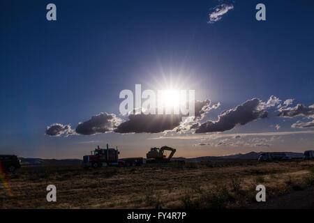 Scenes along Interstate 5 near Patterson California late in the day with car and truck traffic and the sun Stock Photo