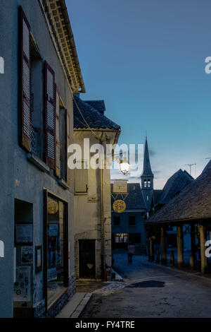 Evening. Houses along the alley in Mens with view on church tower Stock Photo