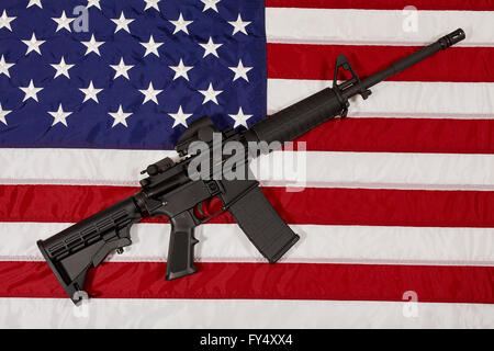 AR15 M4A1 M16 Style Weapon Automatic Rifle on USA Flag concept freedom justice liberty patriotism Stock Photo