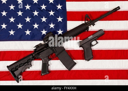 AR15 M4A1 Style Weapon Automatic Rifle and Pistol on USA Flag concept freedom and justice Stock Photo
