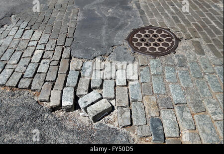 A mix of different types of setts in disrepair on a street in Soho in Lower Manhattan in New York City Stock Photo