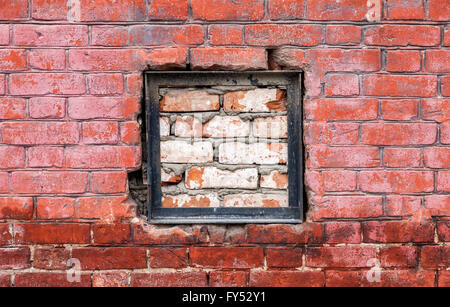 Old weathered red brick wall as background Stock Photo