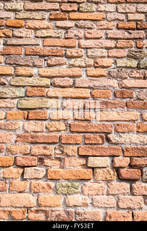 Ancient Roman wall of bricks made by hand. Stock Photo
