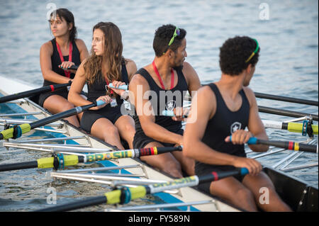 RIO DE JANEIRO - APRIL 2, 2016: A quadruple scull boat (with four rowers) competes in a race on Lagoa Rodrigo de Freitas lagoon. Stock Photo