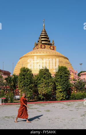 Monk walking in front of stupa at Sitagu International Buddhist Academy, Sagaing near Mandalay, Burma, Myanmar Stock Photo