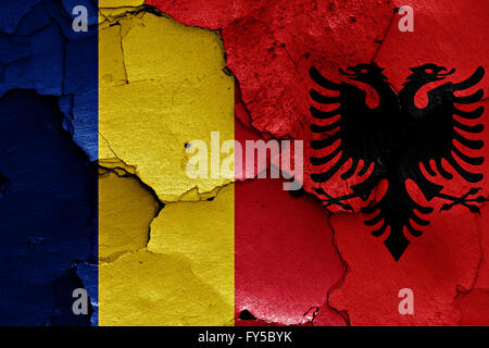 flags of Romania and Albania painted on cracked wall Stock Photo