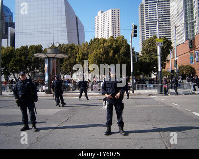 SAN FRANCISCO, CA - OCTOBER 25: SFPD Police officers stand on street as protesters of Marijuana rights stand behind fence along Howard street on October 25, 2011 in San Francisco. Stock Photo