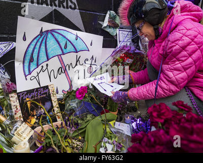 Minneapolis, MN, USA. 22nd Apr, 2016. MINA LEIERWOOD, from Minneapolis, MN, leaves a thank you card at a memorial for Prince in front of 1st Ave in Minneapolis. She said listened to Prince's music all through high school. Thousands of people came to 1st Ave in Minneapolis Friday to mourn the death of Prince, whose full name is Prince Rogers Nelson. 1st Ave is the nightclub the musical icon made famous in his semi autobiographical movie ''Purple Rain.'' Prince, 57 years old, died Thursday, April 21, 2016, at Paisley Park, his home, office and recording complex in Chanhassen, MN. (Cr
