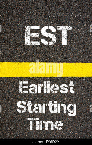 Concept image of Business Acronym EST Earliest Starting Time written over road marking yellow paint line Stock Photo