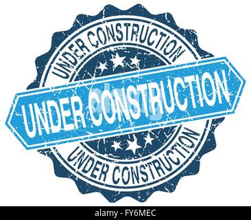under construction blue round grunge stamp on white Stock Vector