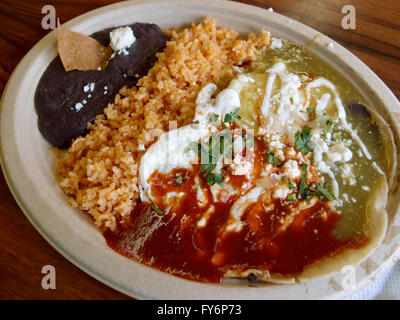 Huevos Divorciados: Divorced Eggs: Two eggs served in the style of Huevos Rancheros but with one egg smotherd in red slasa and t Stock Photo