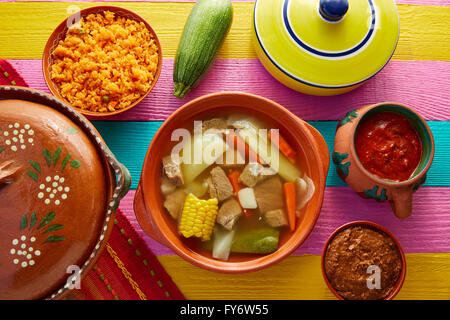 Caldo de res Mexican beef broth in table with sauces Stock Photo