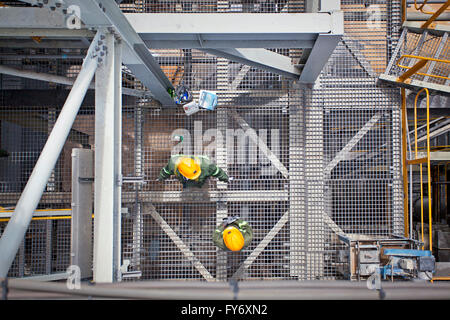 Aerial view of two mine employees in yellow hard hats Stock Photo