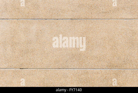 Rough texture surface of exposed aggregate finish, ground stone washed wall, made of small sand stone mixed Stock Photo