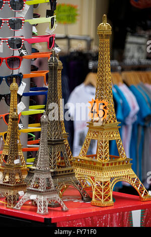 Miniature metal Eiffel Tower for sale as souvenir in a Parisian souvenir shop. Paris,France Stock Photo