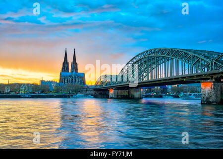 Cologne Cathedral with Hohenzollern Bridge in Cologne, Germany. Stock Photo